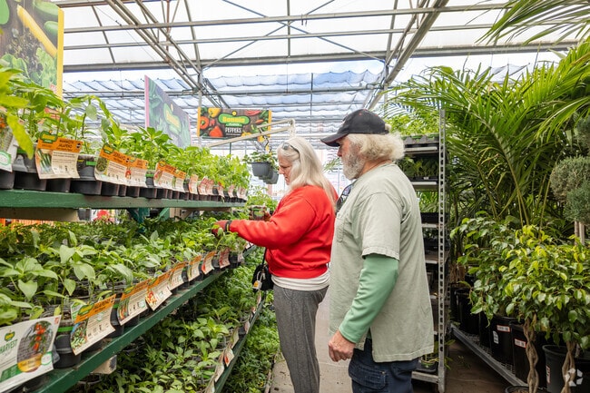Rochester gardeners stock up in the Lowe’s garden center for weekend projects.