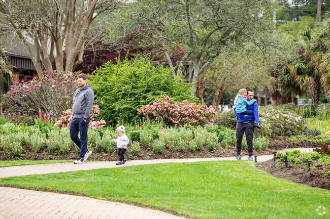 Families enjoy taking walks along the beautiful paths of Mercer Botanical Gardens in Spring.