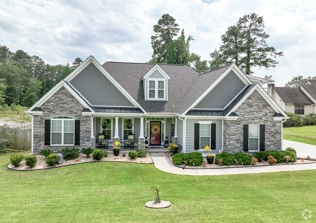 A newer home that was voted yard of the year in Belair .