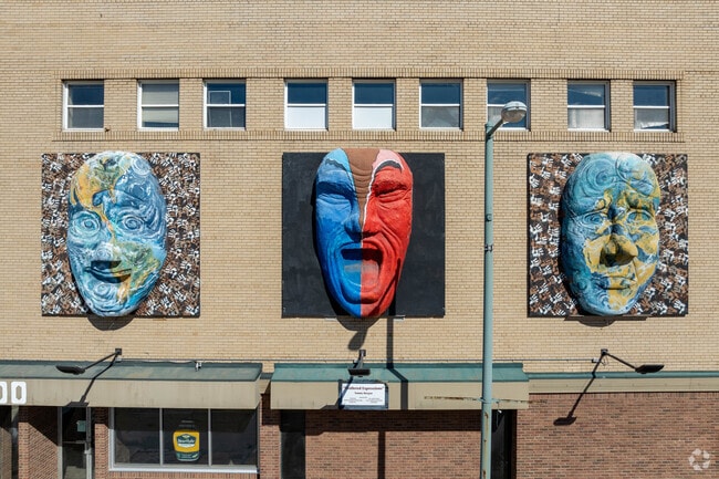 Shattered Expressions" by artist Tommy Morgan hangs on a building in downtown Canton.