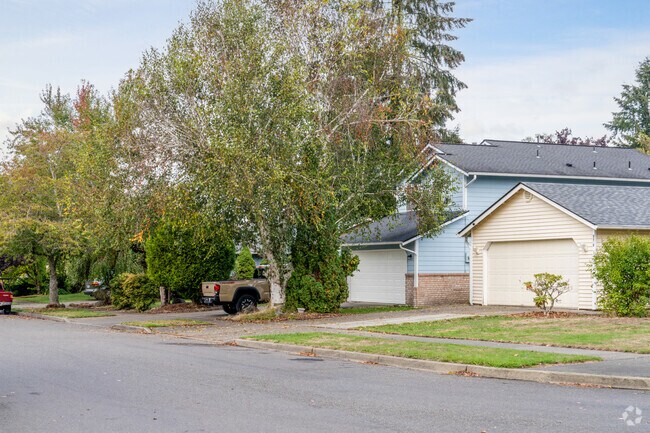A beautiful row of homes in Lakepointe, each with unique designs and inviting curb appeal.