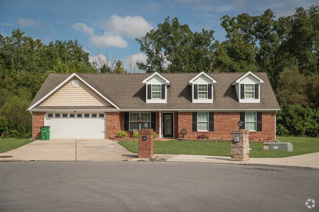 A Cape Cod influenced home in Graysville features multiple dormers.