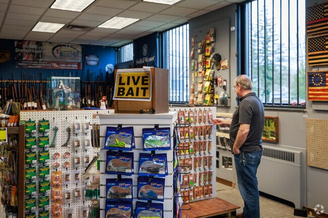 A man browses the fishing lures at Butter-nut Sport Shop in Minoa.