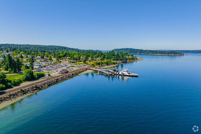 The shoreline of North Lakewood has a ferry landing to cross the sound to Anderson Island.