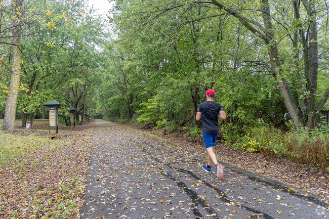 A jogger runs along the Cardinal Greenway at the Rotary Park in Muncie, IN.