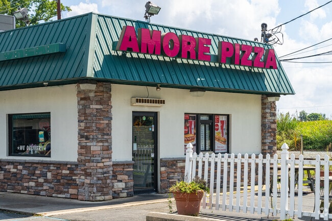 Oven hot pizza can be picked up or delivered to your door from Amore Pizza in Kirkwood.