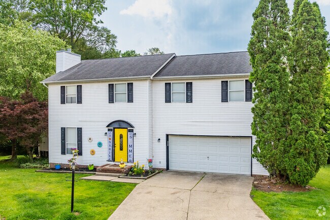 A two-story home in Teays Valley features an attached two-car garage.