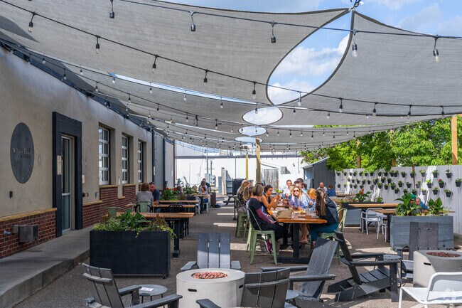 Nouvelle Kitchen & Brewery is a pizza joint serving imaginative pies & draft beers amid pig-themed decor.