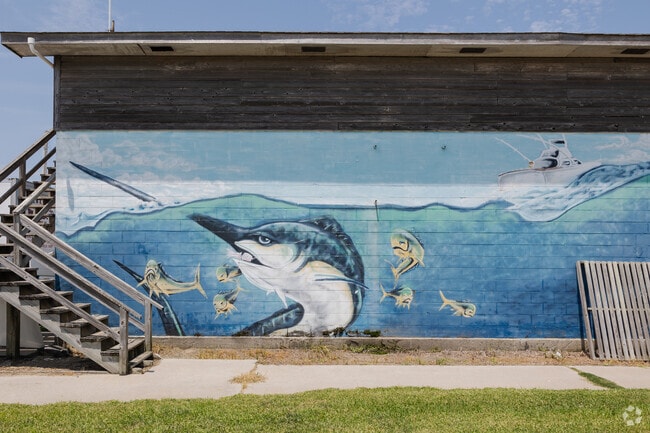 Beautiful coastal murals can be frequently seen on buildings around Hatteras.
