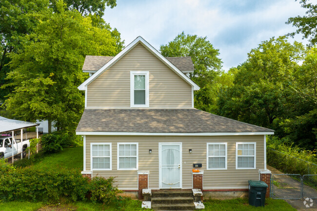 This Craftsman-style home overlooks the quiet neighborhood of Thomas.