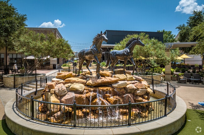 The horse statue in Cinco Ranch La Cantera is called 