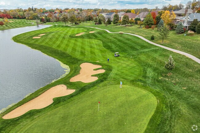 Residents test out their putting skills at the Cherry Blossom Golf Club.