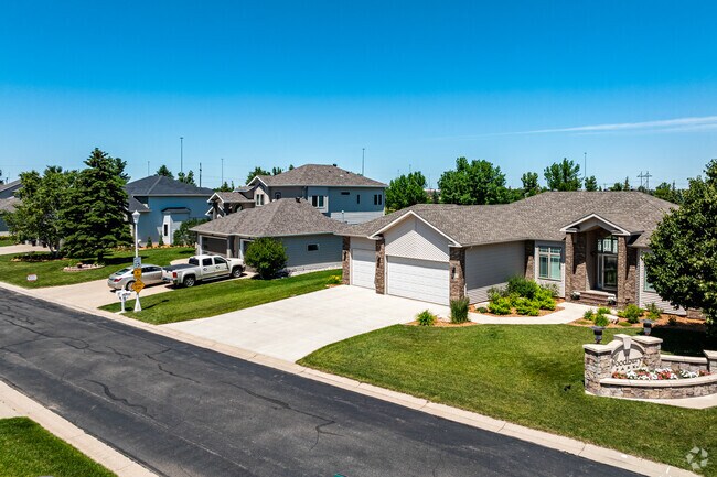 Explore Bluemont Lakes' rows of homes, each with unique architectural charm.