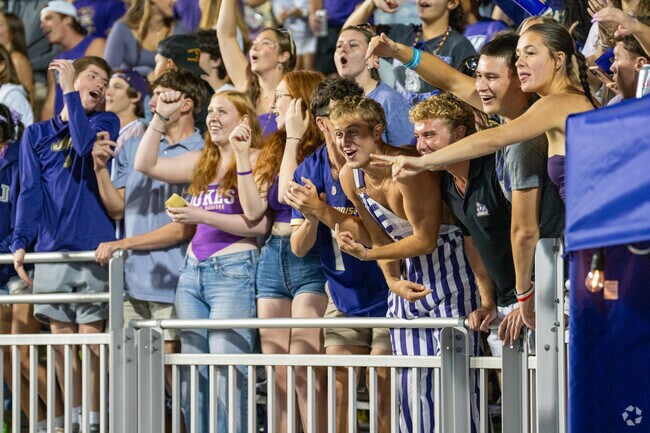 JMU fans at Bridgeforth Stadium, next to the Pleasant Acres neighborhood, get on the jumbotron.
