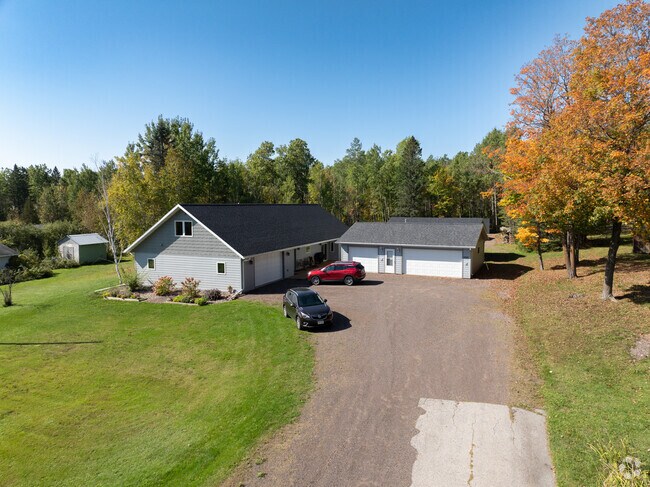 Modern homes mix with early‑1900s bungalows across Rice Lake.
