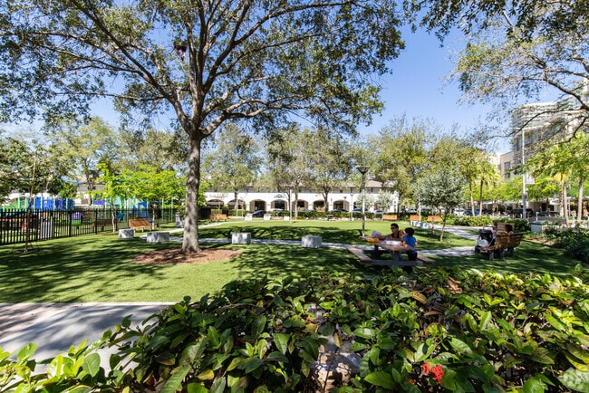 Shaded picnic area and playground at Mpark.
