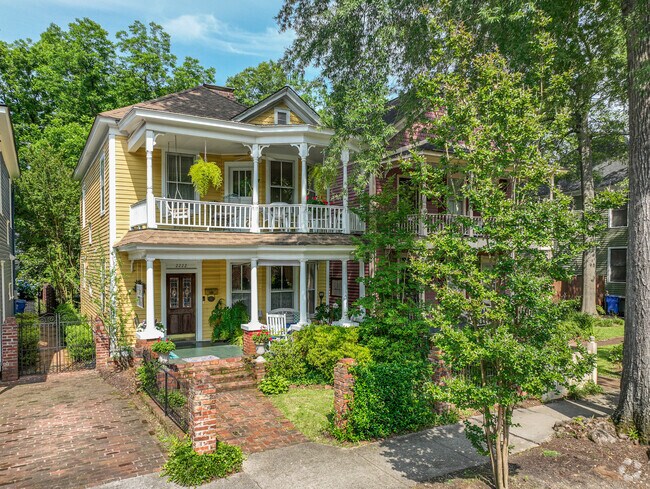 Elmwood Park offers double story, shaded decks and brick walks.
