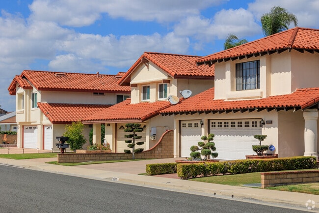 A row of newer homes featuring Spanish style.