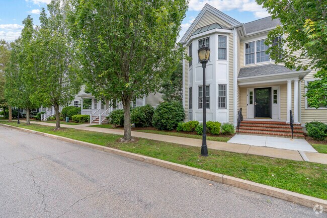 Larger contemporary-style townhouses line Preston Square in Marina Bay.