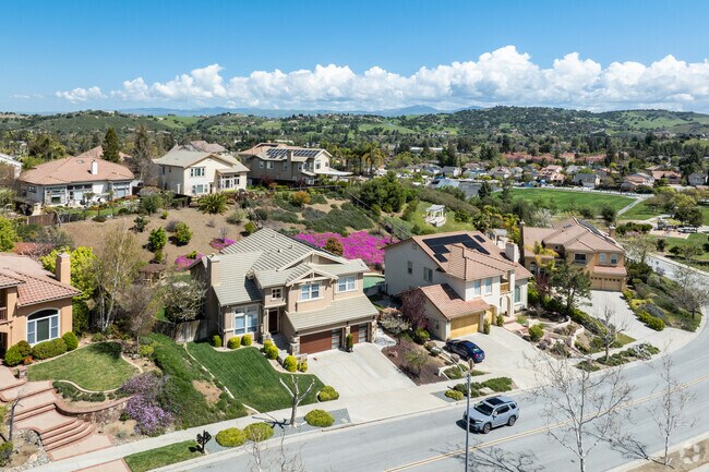 Rolling hills and mature trees define the peaceful streets of this South San Jose neighborhood.