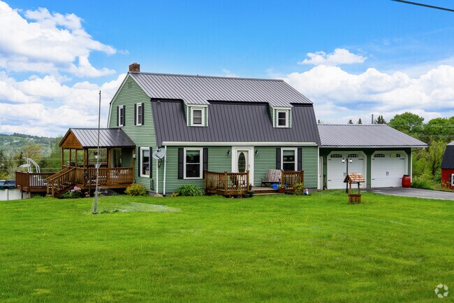 A Dutch colonial style home in Derby Center is distinguished by its gambrel roof and classic symmetry.