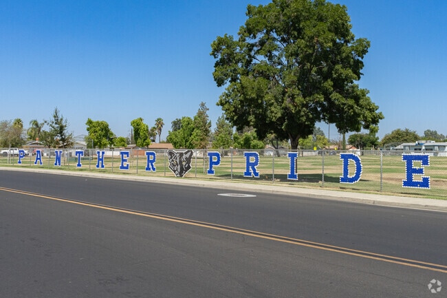 A fence sign at Lee Richmond Elementary School features mascot name.