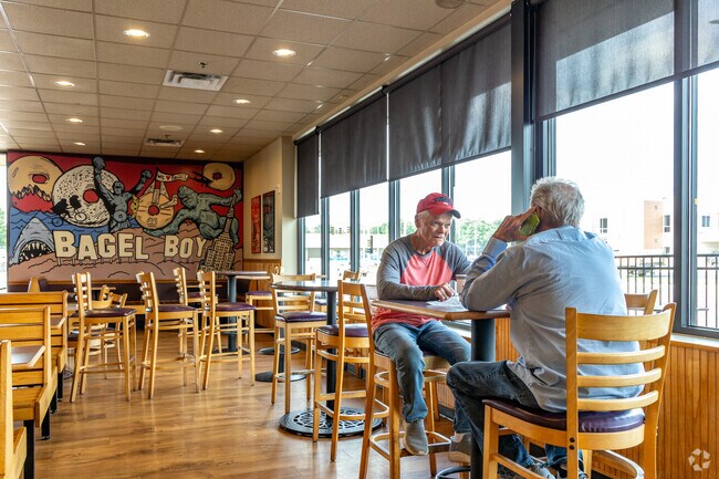 McKennan Park residents enjoy time at the local Bagel Boy.