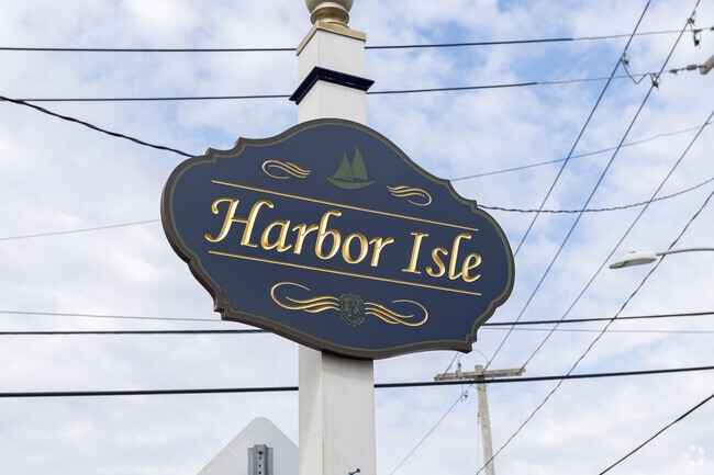 Signage greets you as you enter Harbor Isle via one of the two roadways over the canal.