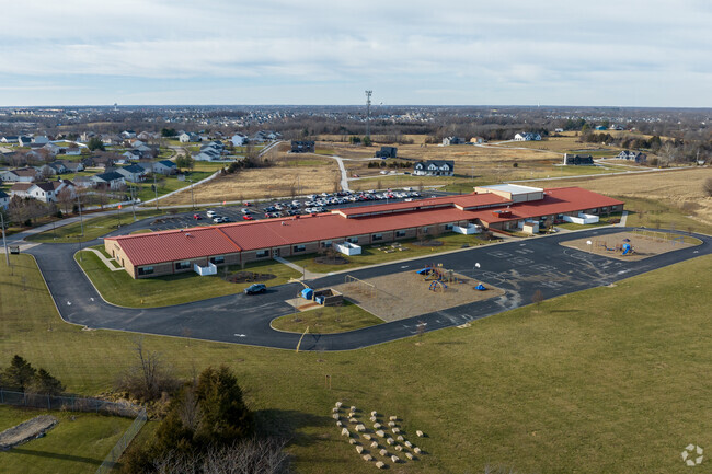 Flint Hill Elementary School has a large playground and recess area behind the main building.