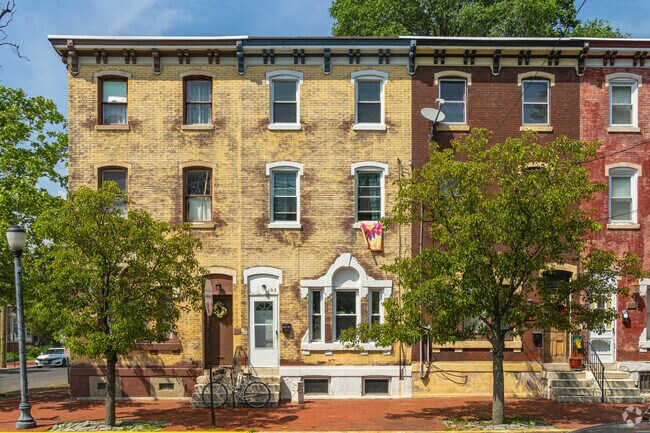 Row homes in Cooper Grant typically have large bay windows looking out to the street.
