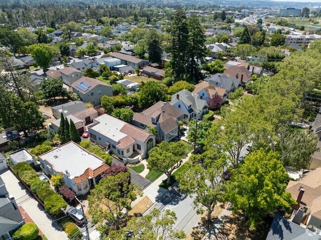 Aerial view of Burlingame Gardens showcasing row homes and tree-lined streets.