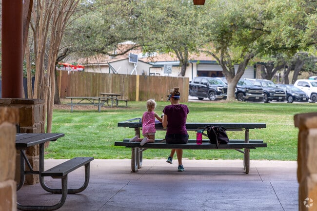 Families enjoy a picnic at the local neighborhood park in Rollingwood.