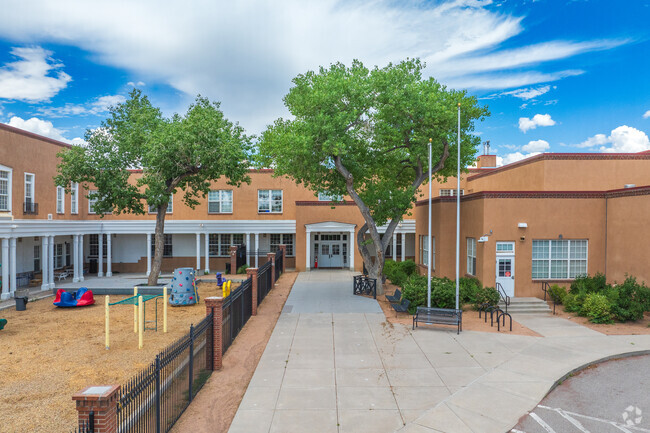 The front entrance to Carlos Gilbert Elementary School welocomes students.