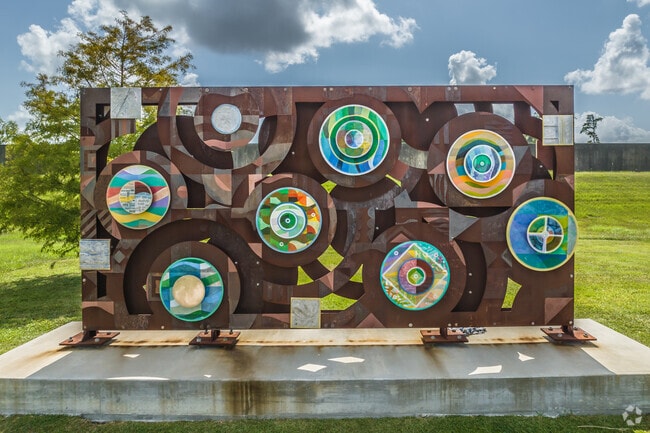 Colorful artwork adorns the lawn at Levee Exhibit Hall and Garden near Saint Anthony.
