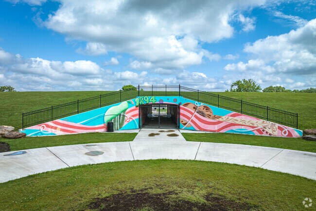 The mural in and around the tunnel along the berm boasts vibrant colors in Pearland.