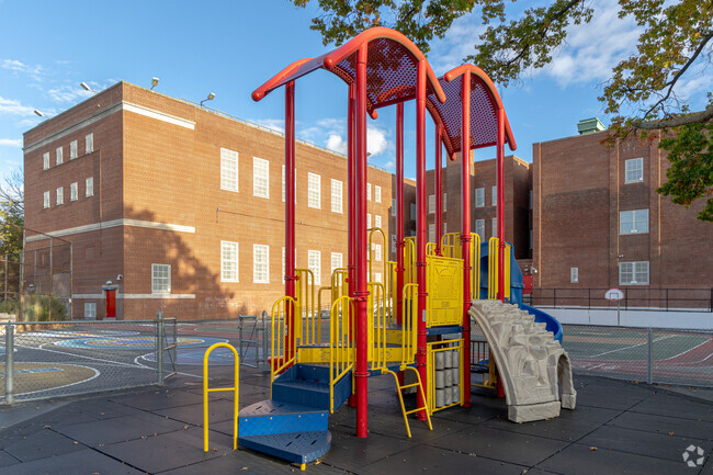 P.S. 46 has colorful equipment and green surroundings.