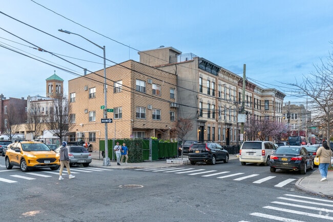 The streets of Astoria are calm, filled with low-rise dwellings.