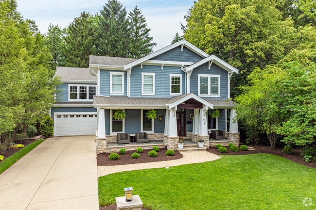 A New Traditional home with a well maintained yard in East Highland.