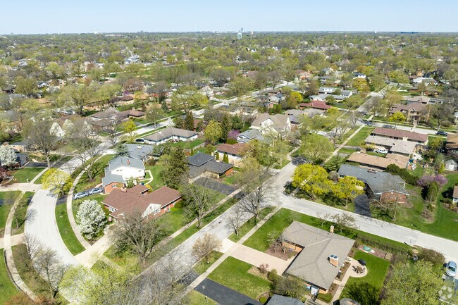 Homes on Quiet Streets Face This Grassy Community Hub in Springdale.