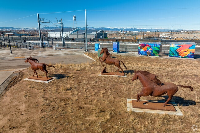 You can find sculptures waiting for you when exiting the train in Elyria-Swansea.