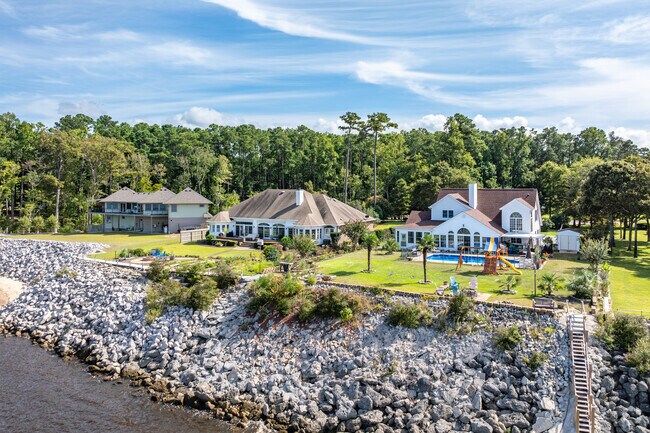 Custom homes in Cherry Branch perch above the rocky shoreline of the Neuse River in Havelock.