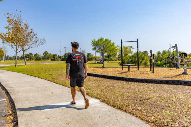 Viera Regional Park features scenic walking trails that wind through lush green spaces, providing a peaceful setting for exercise or leisurely strolls around the park.