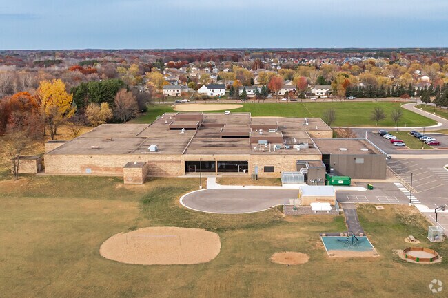 Playtime counts – Isanti Middle School features hard-surface courts with basketball hoops and tetherball for student recreation.