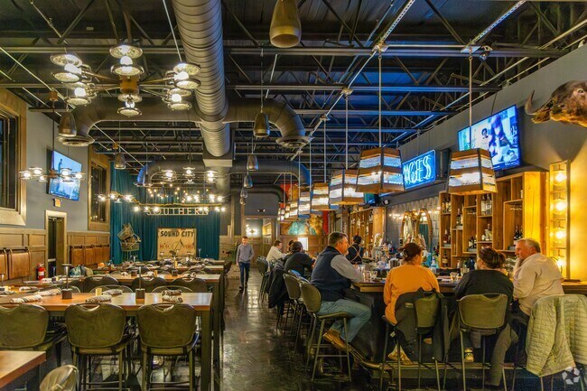 Locals can grab a cocktail and dinner with friends at Southern Grocery in The Shoals.