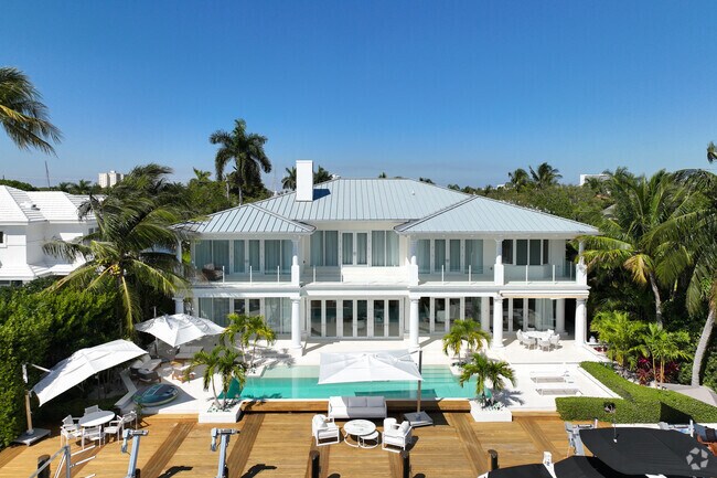 Multi-level home with a large outdoor entertaining area and pool in Sunrise Key.