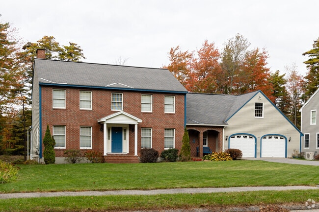 This colonial with an attached garage sits in Stanwood Park.