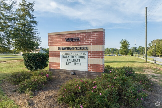 The new school sign sitting at the entrance of Winder Elementary .