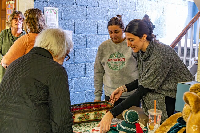 Families enjoy festive treats and shopping at the Green Village Holiday Bazaar.