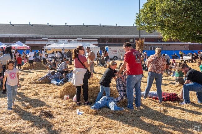 There is a lot of excitement at the scarecrow building area at Harvest Fair near Woodlawn Manor.