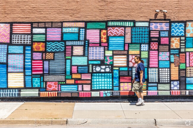 Several colorful murals along 6th Avenue give the neighborhood bright and cheery character.